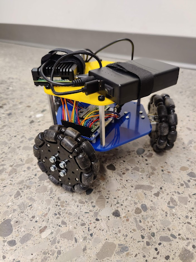 An omnidirectional rover with three roller wheels and onboard electronics.